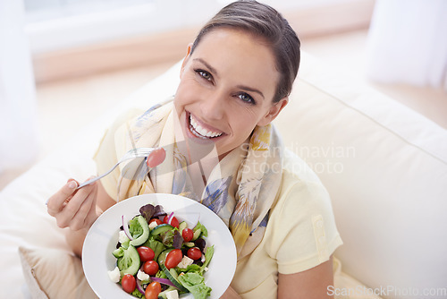 Image of Healthy food, woman in portrait with salad and diet, organic vegetables and relax on sofa with smile for weight loss. Vegan meal, gut health and wellness, eating for nutrition with vitamins and lunch