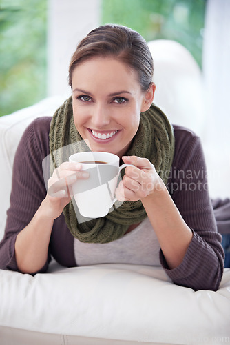 Image of Woman, happy in portrait and coffee, relax in apartment for comfort or morning routine with warm drink. Caffeine beverage in living room, latte or espresso for chill at home with positive attitude