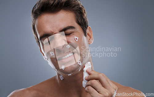 Image of Man, face and shave cuts in studio for hair removal hygiene or injury with blood, tissue or maintenance. Male person, grey background and dermatology with beard or clean health, wellness or mockup