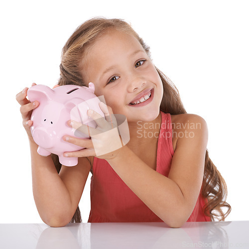 Image of Girl child, piggy bank and listen for money, studio and check with pride for savings by white background. Confused kid, portrait and animal toys for coins, cash or learning for financial education