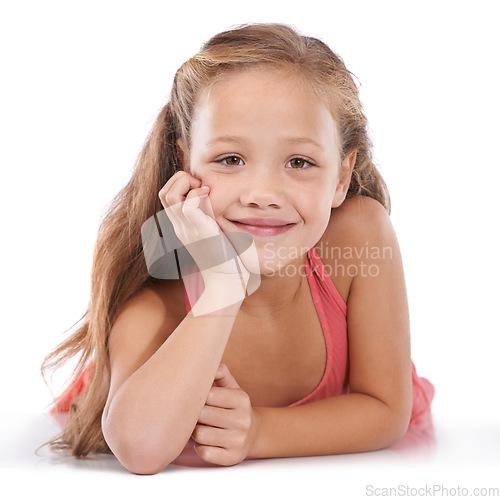 Image of Kid, girl and portrait or happiness in studio with confidence, positive attitude and carefree youth. Child, face and smile with calm expression, mock up space and casual outfit on white background