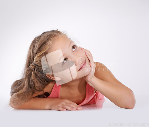 Image of Thinking, kid and girl with ideas or decision and contemplation on white studio background. Model, mockup space and child development with daydreaming, wonder or planning with choice, happy or ponder