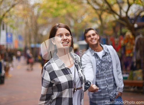 Image of Happy couple, portrait and woman walking, holding hands and lead partner on city journey, morning trip or tour of urban Paris. Love, tourism town and people bonding together on relax commute