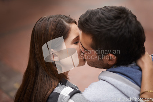 Image of Love, city and face of couple kiss, bonding together and enjoy outdoor date with care, support and partner commitment. Devotion, relationship connection and romantic people in sweet intimate moment