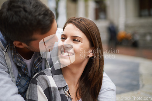 Image of Love, eye contact and happy couple hug together, relax and enjoy outdoor date with care, support and romance. Wellness, happiness and face of boyfriend, girlfriend or people smile for relationship