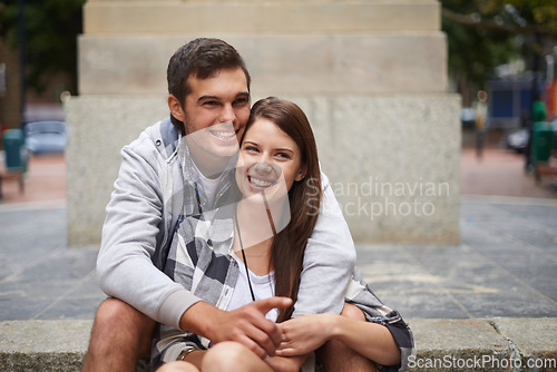 Image of Travel, love and smile with couple in city together for adventure, holiday or sightseeing overseas. Hugging, street or sidewalk with happy young man and woman outdoor for tourism or vacation abroad