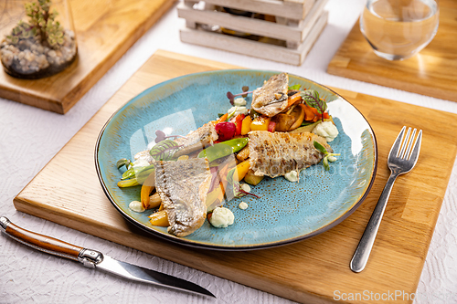 Image of Grilled fish fillet with vegetables