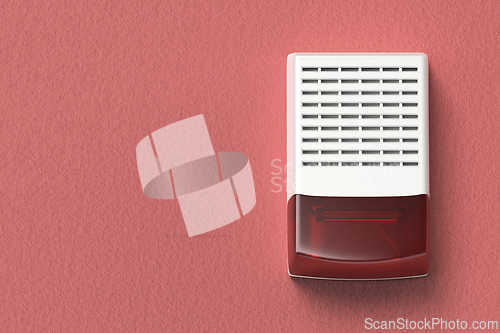 Image of Alarm siren on red wall