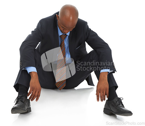 Image of Depression, unemployment or fail with business black man on floor of studio isolated on white background. Economy, financial crisis and employee in suit fired from career, job or work with stress