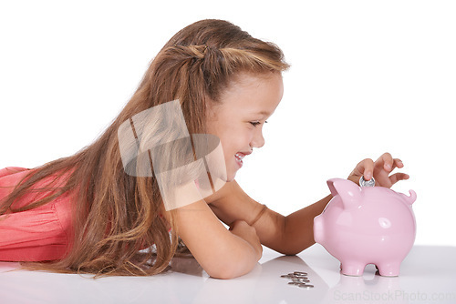 Image of Girl child, piggy bank and coins for saving, studio or thinking with smile for investing by white background. Confused kid, container or animal toys for money, cash or happy for financial education