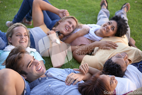 Image of Relax, friends and happy group on grass at park on vacation, holiday or summer. People, smile and team of students on lawn at garden, circle in nature or freedom of young community together outdoor