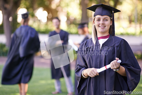 Image of Happy woman, portrait and student with qualification in graduation for education, learning or success. Female person or graduate smile for higher certificate, diploma or degree at outdoor ceremony