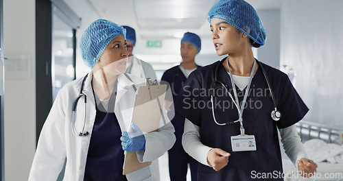 Image of Doctors, nurses and people walking, teamwork or planning healthcare, clinic management and talking of ideas. Medical worker, surgeon and mentor support, hospital feedback and checklist or charts