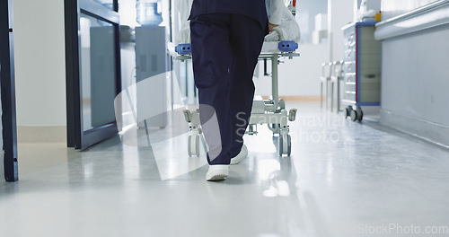 Image of Nurse, feet and walking patient in hospital, bed or steps in hallway or corridor to surgery, operation room or ER healthcare. Doctor, moving and pushing person in clinic to ICU, bedroom or walk