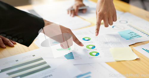 Image of Hands, business people in meeting and data analysis, review paperwork with graphs and info, team doing market research. Stats, analytics and infographic documents with sticky note and collaboration