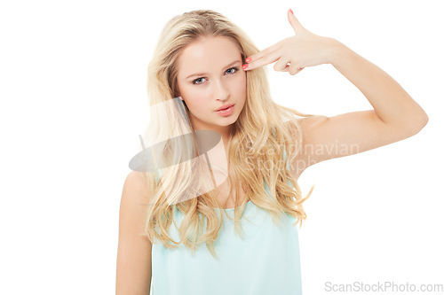 Image of Finger gun, white background and portrait of woman for shooting, aim and pointing to head. Dark humor, violence and face of isolated person with hand gesture, symbol and icon for joke in studio