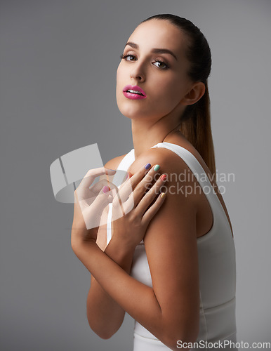 Image of Woman, portrait and manicure with pink lipstick for beauty, rainbow nail polish and cosmetics on grey background. Cosmetology, lips and color nails with makeup, confidence and glamour in studio