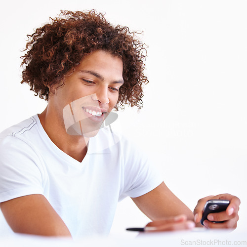 Image of Man, phone and writing notes for message or reminder in studio, email and information on white background. Male person, contact and networking or online research, tech and connection to internet