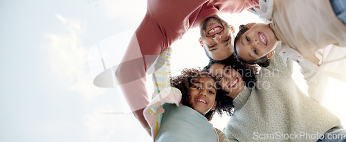 Image of Face, happy family and bottom hug outdoor for care, love or bonding on vacation, holiday and low angle. Smile, portrait of parents and children embrace together, having fun or enjoying quality time