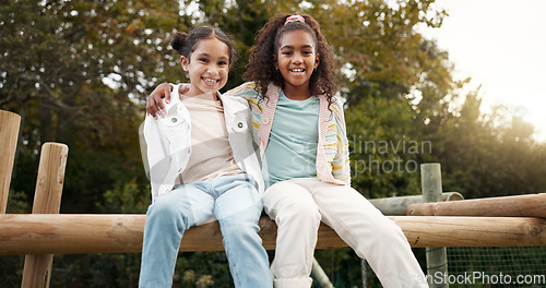 Image of Friends, happy and children hug in park on jungle gym for bonding, childhood and having fun on playground. Friendship, outdoors and portrait of young girls embrace for playing, freedom and adventure