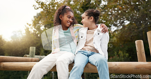 Image of Friends, happy and children hug in park on jungle gym for bonding, childhood and having fun on playground. Friendship, outdoors and portrait of young girls embrace for playing, freedom and adventure