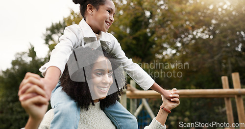 Image of Mother, daughter and piggyback walking in park or garden for fun bonding, holiday or weekend outside. Happy mom carrying her child on shoulders for family time together in nature or forest by house