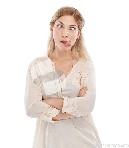 Image of Funny face, tongue and squint with woman arms crossed in studio isolated on white background for humor. Emoji, comedy or joke and confident young comic feeling silly or goofy with weird body language
