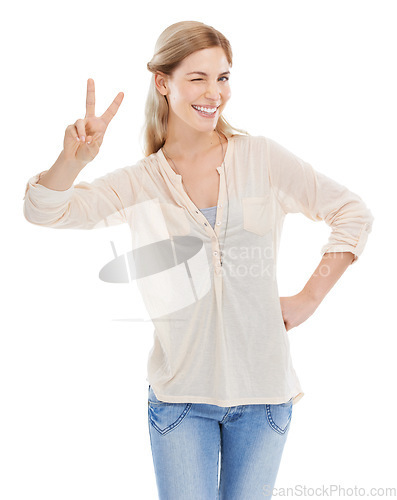 Image of Smile, peace sign and woman wink in portrait at studio isolated on a white background. Girl blink, fingers and v hand gesture, emoji and young female model with symbol for victory, success or winning