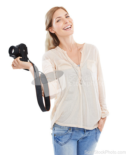 Image of Portrait, photographer and smile of woman with camera in studio isolated on a white background. Confident person, creative paparazzi and technology for hobby, taking pictures or professional shoot