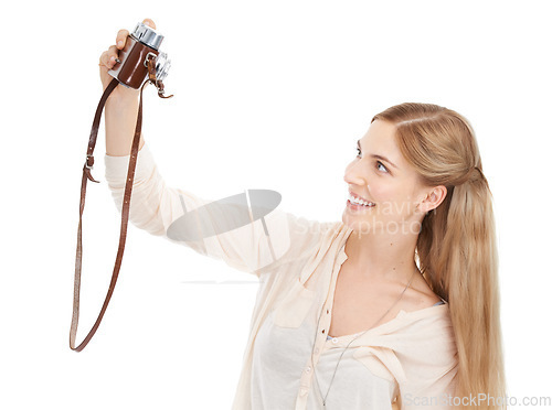 Image of Camera, happy woman and selfie in studio for fun hobby, memory or photoshoot on white background. Lens, face or female model smile for self portrait with vintage, retro or photography equipment