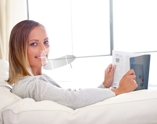 Image of Woman, magazine and portrait on sofa with relax for story, article or information and happy in living room. Person, face and morning routine on couch with print media or lifestyle blog for break