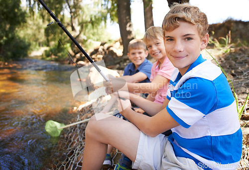 Image of Children, portrait and fishing rod at river in nature for holiday fun at countryside for vacation, learning or travel. Kids, boys and net for catch adventure at lake for teamwork, teaching or relax