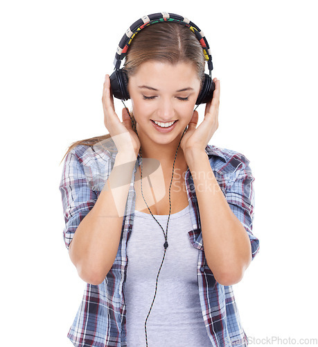 Image of Woman, headphones and listening to music in studio for audio for streaming entertainment, track or white background. Female person, smile and headset for radio techno, subscription or mockup space