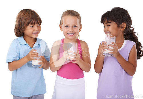 Image of Children, drink and milk mustache on face with nutrition, health and wellness in white background of studio. Calcium, dairy and kids smile in portrait with benefits in diet for teeth and growth