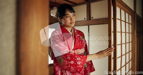 Image of Japanese, woman and kimono in corridor for tradition, tea ceremony and hallway of Chashitsu room or door. Entrance, person and vintage dress or fashion for temae, ritual and waiting for hospitality