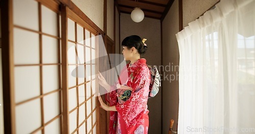 Image of Japan, woman and kimono in corridor for tradition, tea ceremony and hallway of Chashitsu room or door. Entrance, person and vintage dress or fashion for temae, ritual and waiting for hospitality