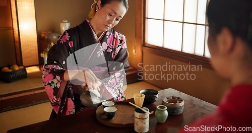 Image of Japanese, woman and matcha for tea ceremony in Chashitsu room with kimono dress and traditional custom. Person, temae and vintage style outfit for culture, fashion and honor with antique crockery