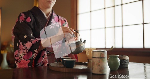 Image of Japanese, woman and matcha for tea ceremony in Chashitsu room with kimono dress and traditional custom. Person, temae and vintage style outfit for culture, fashion and honor with antique crockery