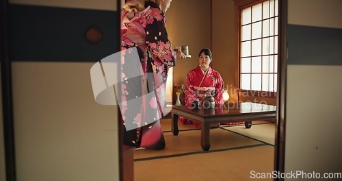 Image of Japanese, women or matcha tea in kimono for ceremony in Chashitsu room with custom tradition or culture. People, temae and vintage outfit or dress for heritage, respect or pride with serving guest
