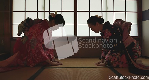 Image of Japan, women or bow in kimono for greeting in tea ceremony or Chashitsu room for custom tradition. People, temae and vintage style outfit or dress for culture, respect or welcome with pride on floor