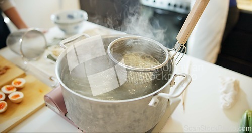 Image of Cooking, kitchen and Japanese noodles in pot in boiling water for lunch, meal preparation and dinner. Food, cuisine and traditional dish, ingredients and steam for wellness, diet and nutrition