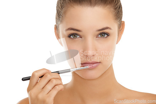 Image of Makeup, brush and portrait of woman with lipstick application in studio for cosmetics on white background. Beauty, mouth or face of female model with gloss, color or full lips, volume or filler