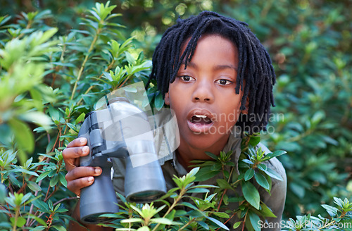 Image of Nature trees, binocular and child surprise over discovery on adventure, outdoor exploration or bird watching trip. Forest, bush leaves and kid with wow facial expression for search in tropical jungle