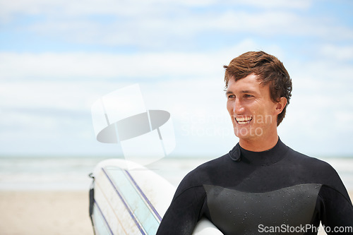 Image of Surfing, happy and man with surfboard on beach for water sports training, freedom and fitness outdoors. Nature, smile and person with mockup space for adventure on holiday, vacation and hobby by sea