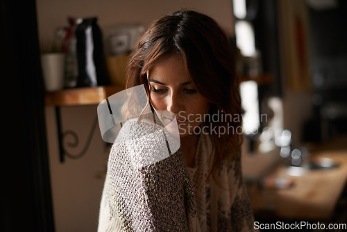 Image of Sad, depression and young woman at house with upset, grief and mad facial expression for problem. Mental health, emotion and lonely female person looking down with unhappy face for loss at home.