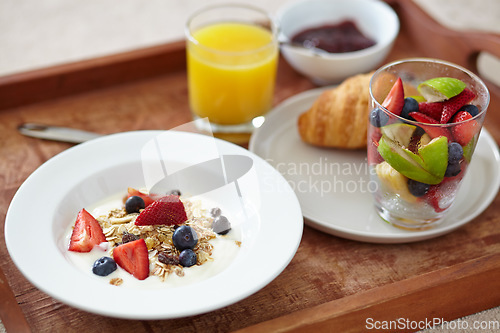 Image of Food, wellness and closeup of breakfast tray with muesli for balance, benefits or gut health. Fruit, zoom and croissant with vitamins for diet, nutrition or healthy eating, brunch or superfoods salad