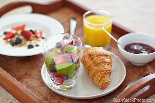 Image of Wellness, closeup and breakfast food tray with fruit for balance, benefits or gut health. Muesli, zoom and croissant with vitamins for diet, nutrition or healthy eating, brunch or superfoods salad