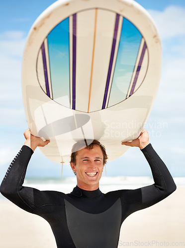 Image of Surfing, beach and portrait of man with surfboard for water sports training, freedom and fitness outdoors. Nature, happy and person excited for adventure on holiday, vacation and hobby by ocean