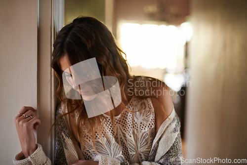 Image of Sad, depression and young woman at a home with upset, grief and mad facial expression for problem. Mental health, lonely and tired female person looking down with unhappy face for loss at house.