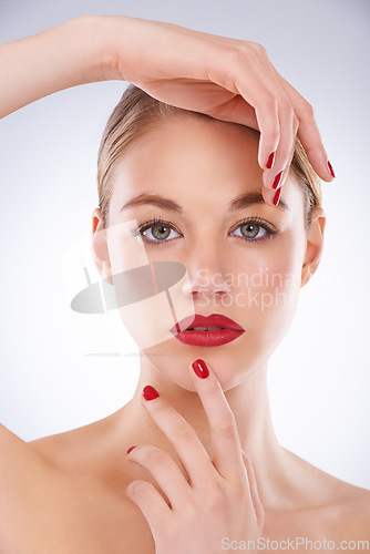Image of Woman, portrait and makeup in studio with manicure for cosmetics, beauty and aesthetic with red lipstick. Model, person or confidence with skincare, glowing face and skin wellness on white background